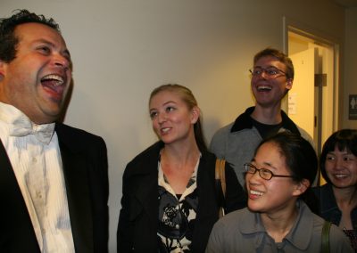berick laughs backstage with students